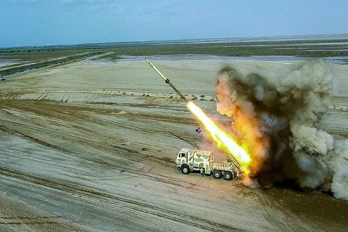 This handout photo provided by Iran's Revolutionary Guard Corps (IRGC) on July 28, 2020 shows rockets being fired from a launch vehicle during a military exercise near the Strait of Hormuz