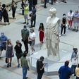 Visitors line up at the entrance to New York's Metropolitan Museum on August 29, 2020 for its reopening after a months-long closing due to the pandemic