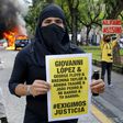 The arrests followed riots in Guadalajara after protesters had gathered to demand justice over Giovanni Lopez's death; a
demonstrator holds a banner during a protest in Guadlalajara, Jalisco