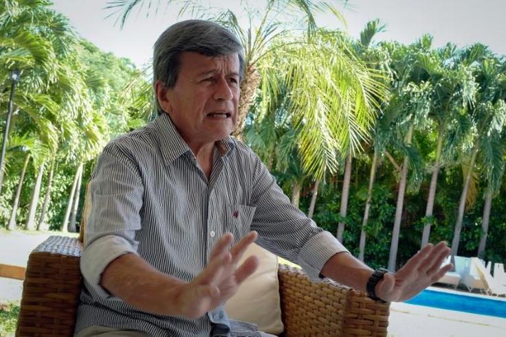 Pablo Beltran, commander of Colombia's ELN rebels, gestures during an interview with AFP in Havana