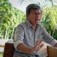 Pablo Beltran, commander of Colombia's ELN rebels, gestures during an interview with AFP in Havana