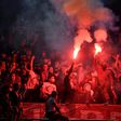 Paris Saint-Germain fans back their team while watching the Champions League final at the Parc des Princes