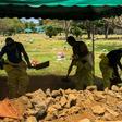 Men dig a grave at a cemetery in the Nicaraguan capital Managua