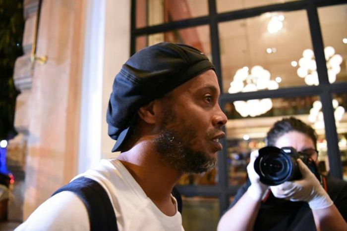 Brazilian former soccer star Ronaldinho arrives at a hotel in downtown Asuncion on April 7 to begin his house arrest after his release from jail