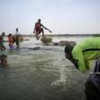 Malian children freshen up in the cool waters of the Niger River before breaking the fast