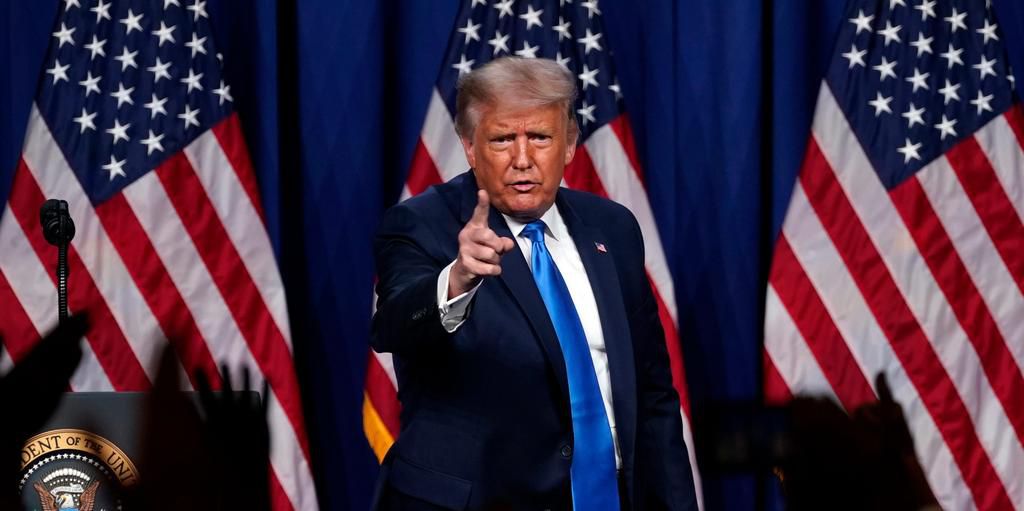 President Donald Trump stands on stage after speaking during the first day of the Republican National Committee convention Monday, Aug. 24, 2020, in Charlotte.