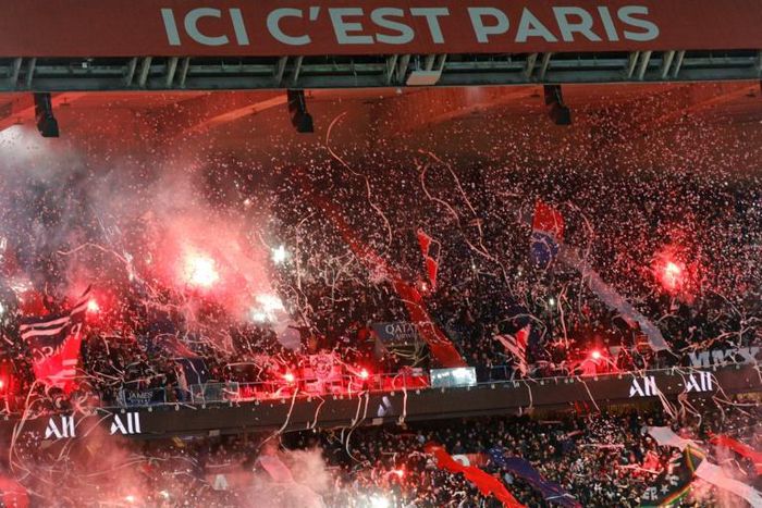 Paris Saint-Germain supporters light up the Parc des Princes in a match in February 2020