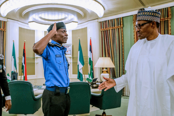 The Inspector-General of Police (IGP), Mohammad Adamu salutes President Muhammadu Buhari. (Channels TV)