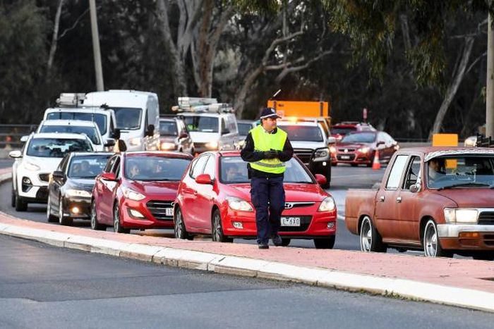 Long queues of cars were backed up at Victoria's border Wednesday after neighbouring state New South Wales closed the boundary