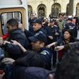 Algerian police detain protesters after a demonstration in the capital Algiers on April 14, 2019