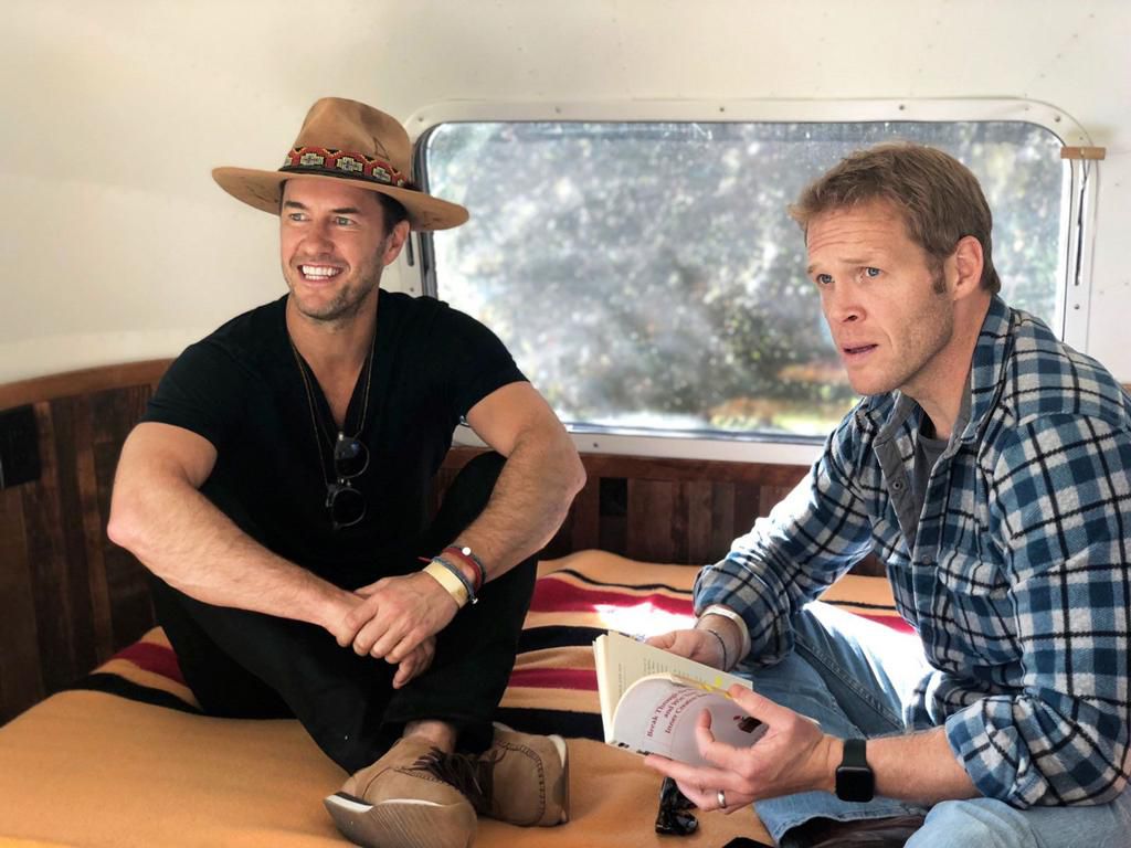 Blake Mycoskie (left) and Patrick Dossett founded a program to help people change their habits for the better.