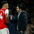 Arsenal boss Mikel Arteta speaks with Pierre-Emerick Aubameyang