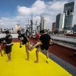 People take part in a Muay Thai martial art class on a roof in Mexico City, on August 15, 2020, as the country stuggles to get in shape amid the coronavirus pandemic