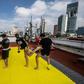 People take part in a Muay Thai martial art class on a roof in Mexico City, on August 15, 2020, as the country stuggles to get in shape amid the coronavirus pandemic
