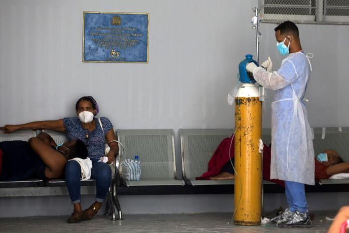 People receive medical attention in the COVID-19 ward of the Moscoso Puello Hospital in Santo Domingo