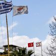 The flags of Greece, Cyprus, Turkey and the self-proclaimed Turkish Republic of Northern Cyprus (TRNC) fly above security outposts in the divided Cypriot capital Nicosia