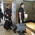 Federal police officers, pictured here carrying seized evidence, raided the residence of the governor of Rio de Janeiro, Wilson Witzel, as part of an anti-corruption investigation