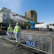 Mondolia health workers and police wear hazmat suits during a coronavirus drill in the capital, Ulaanbaatar