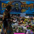A woman burns sage and offers prayers as she pays her respects at a makeshift memorial in honor of George Floyd, on June 3, 2020 in Minneapolis, Minnesota