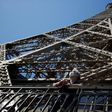 As the Eiffel Tower reopens after 104 days of coronavirus lockdown, elevators and the top observation deck remain off-limits because of social distancing concerns
