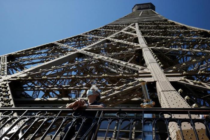 As the Eiffel Tower reopens after 104 days of coronavirus lockdown, elevators and the top observation deck remain off-limits because of social distancing concerns