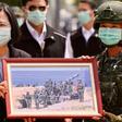 Taiwan President Tsai Ing-wen receives a framed photograph from a masked soldier during the COVID-19 coronavirus pandemic during a visit to a military base in Tainan on April 9, 2020