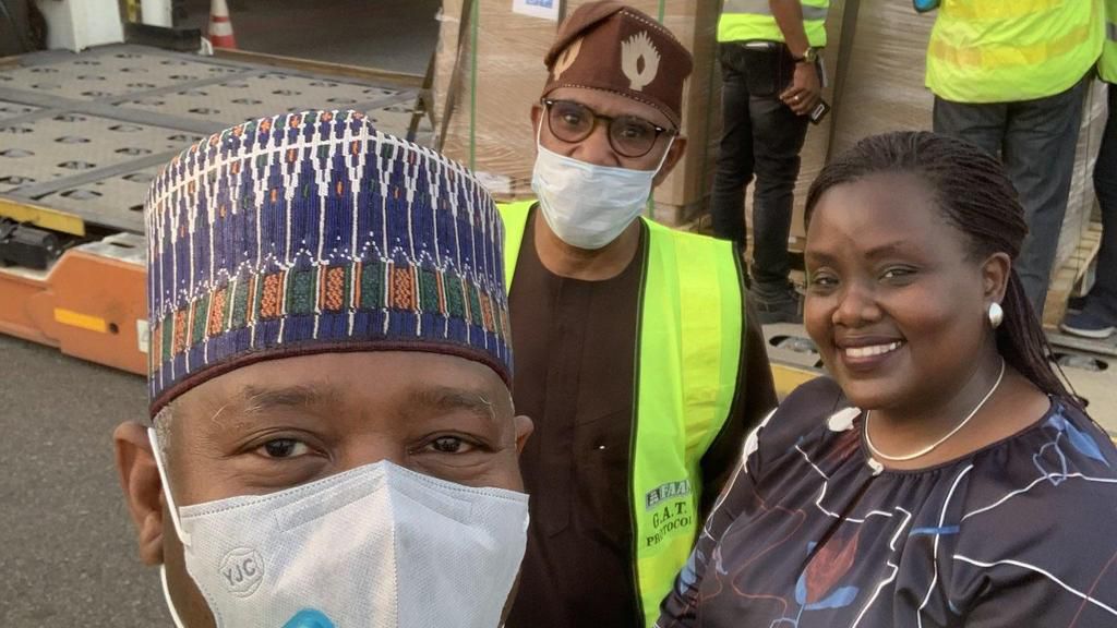 Minister of Aviation, Sen. Hadi Sirika, State Minister of Health, Adeleke Mamora and a government official receive the medical equipment donated by the United Nations [Twitter/@hadisirika]