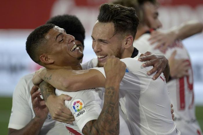 Lucas Ocampos (R) celebrates with teammates after putting Sevilla ahead in their 2-0 win over Betis as La Liga returned after a three-month suspension on Thursday
