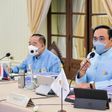 Thai Prime Minister Prayut Chan-O-Cha (R) attends a cabinet meeting Thursday
