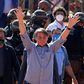 (FILES) In this file photo taken on June 05, 2020 Brazilian President Jair Bolsonaro (C) waves to supporters during the inauguration of a field hospital in Aguas Lindas, in the State of Goiais, Brazil, amid the Covid-19 coronavirus pandemic