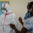 Barrier technique: A doctor at the Kenyatta National Hospital in Nairobi suits up for visiting a ward for people who had been quarantined after coming into contact with Kenya's first coronavirus patient