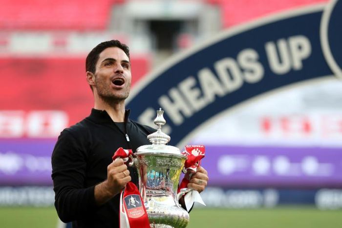 Arsenal boss Mikel Arteta holds the FA Cup trophy