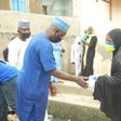 Alhaji AbdulRahman Olarinde, NASFAT Welfare Secretary, distributing Food during the Eid - L-Fitr celebration in Lagos.