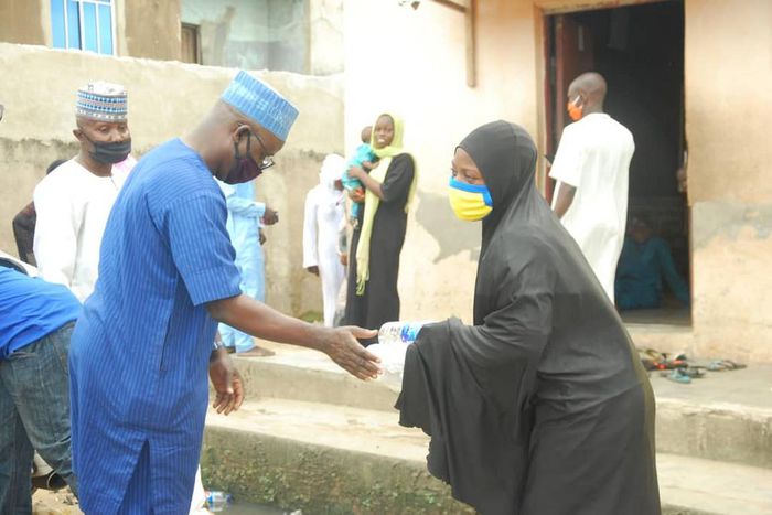 Alhaji AbdulRahman Olarinde, NASFAT Welfare Secretary, distributing Food during the Eid - L-Fitr celebration in Lagos.