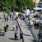 People walk on the banks of the Seine River in Paris on May 15 as France eases lockdown measures taken to curb the spread of the COVID-19 pandemic