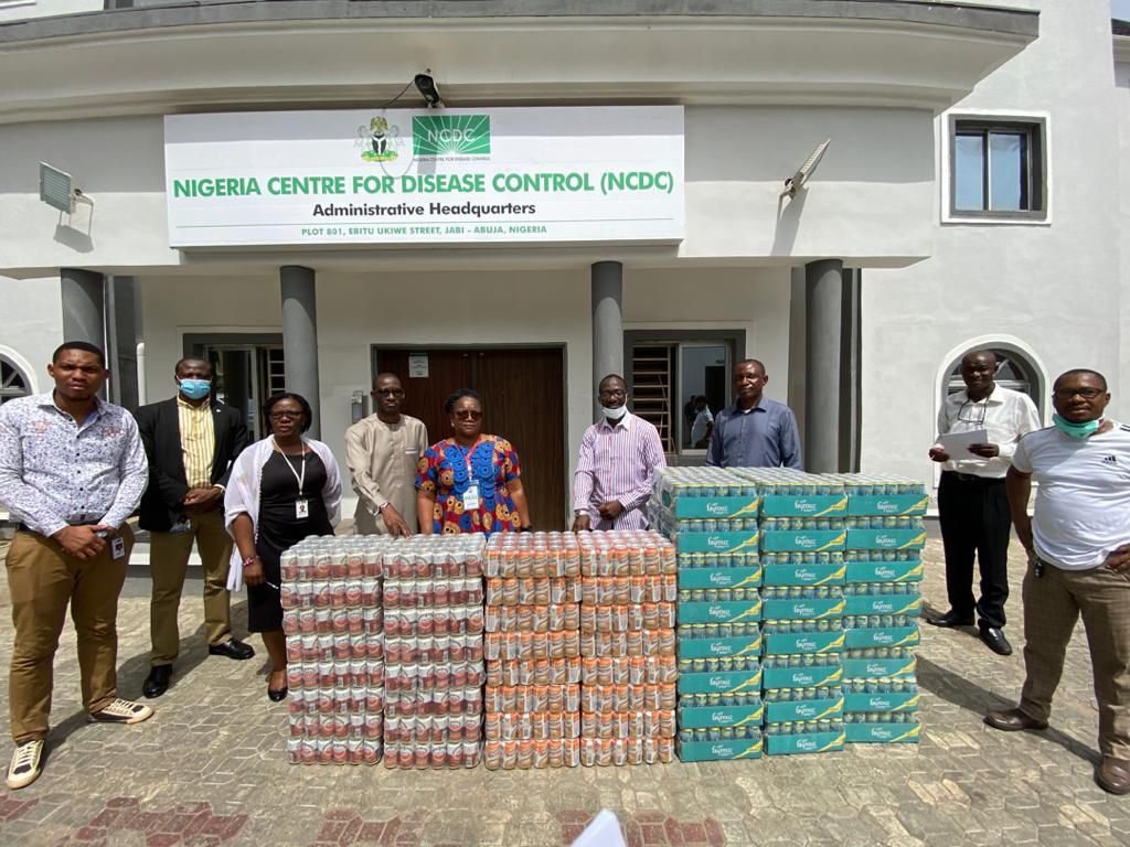 L-R: Director, Special Duties, DG’s Office, Nigeria Centre for Disease Control, Abuja, Dr Priscilla Ibekwe receiving a donation of malt and soft drinks from the Head of Government Relations, Nigerian Breweries Plc, Vivian Ikem as part of the company’s ...