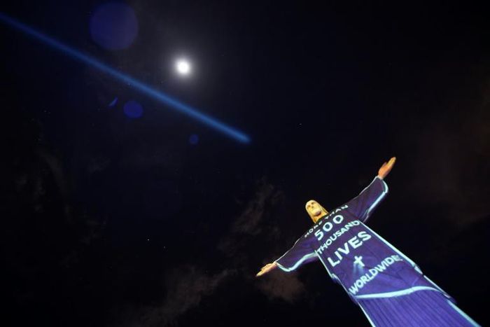 The Christ the Redeemer statue illuminated with a message marking the number of lives lost worldwide to the coronavirus pandemic, which has surpassed 500,000 since it first emerged in China in December