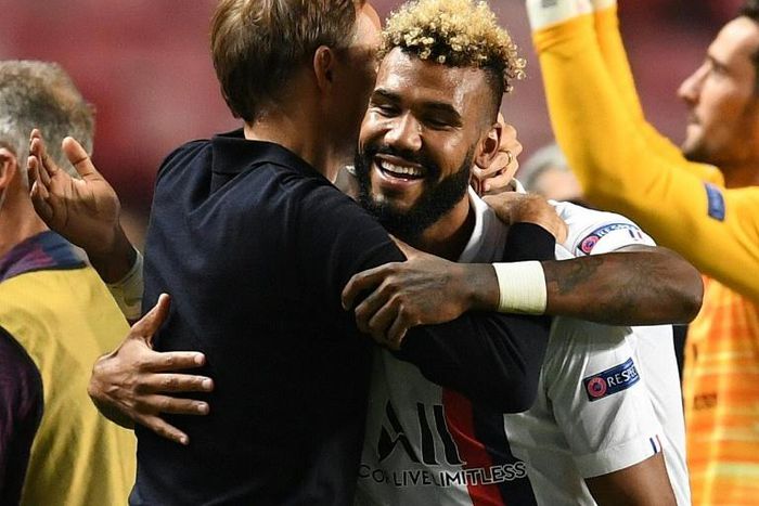 Paris Saint-Germain's Champions League quarter-final matchwinner, Eric Choupo-Moting, gets a hug from coach Thomas Tuchel