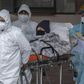 Infections have risen steadily in Chile though it began taking emergency measures in February; health staff transfer a patient with symptoms of COVID-19 at San Jose Hospital, in Santiago, on June 18, 2020