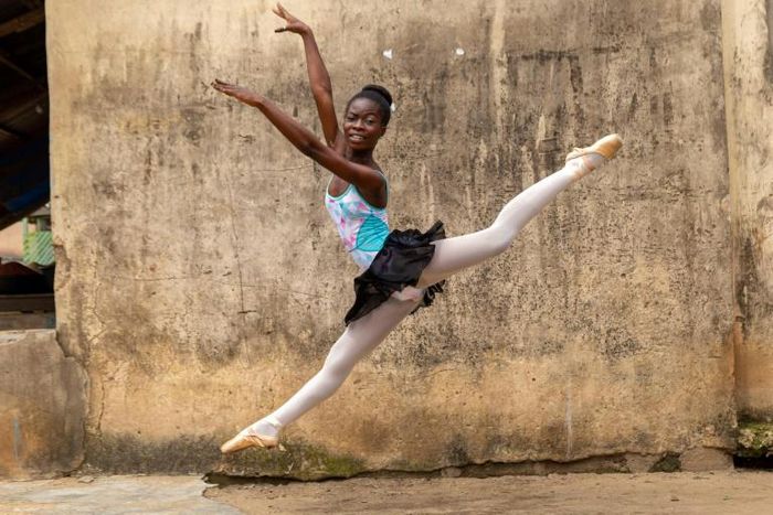 Dancing in the streets: A ballet student of the Leap of Dance Academy in a poor district of Nigerian megacity Lagos