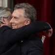 Outgoing president Mauricio Macri embraces his leftist rival and new Argentine President Alberto Fernandez at the inauguration in Buenos Aires on December 10, 2019