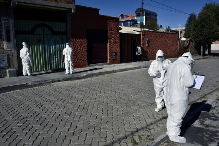 Health workers visit homes to check for possible COVID-19 cases in El Alto, Bolivia