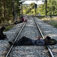 Migrants wait for a train to take them from Idomeni to a new life