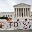 Pro-immigration activists in front of the US Supreme Court after the court upheld the DACA "Dreamers" program offering legal protections to some 700,000 people brought into the country illegally as children