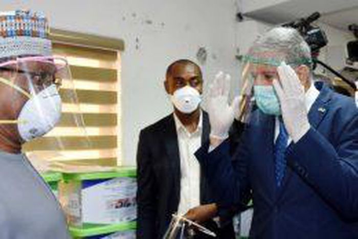 Ambassador of Israel, Amb. Simone Ben-Shoshan (R), speaking to the Minister of Health, Dr Ehenire Osagie (L) on the protective face masks donated by the Embassy in Abuja on Thursday (NAN)