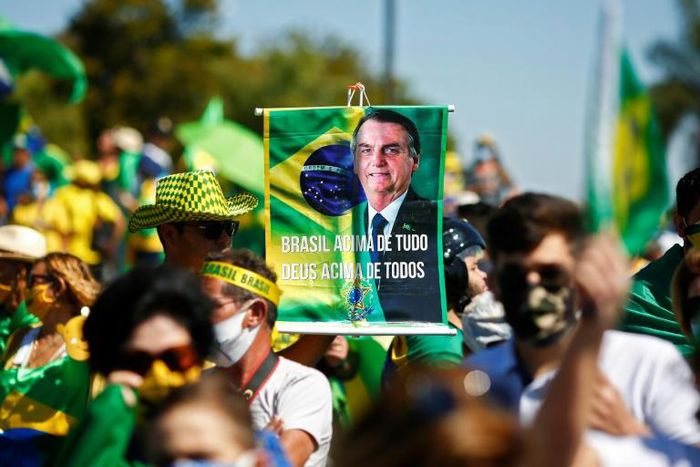 A supporter brandishes a banner showing Brazilian Jair Bolsonaro, who has repeatedly evoked the threat of a "coup"