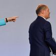 German Chancellor Angela Merkel points to Finance Minister Olaf Scholz after announcing the new stimulus package