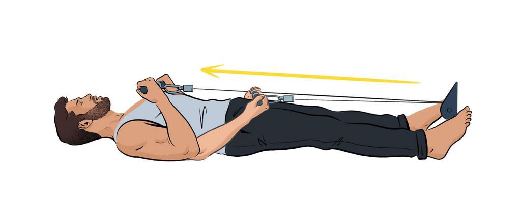 Man curling from a cable while lying on the ground.