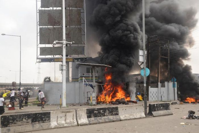 Hoodlums masquerading as #END FSARS protesters set ablaze Orile Iganmu Divisional Police Station along Lagos Badagry ExpressWay, on Tuesday. Oct. 20, 2020 (NAN photo)