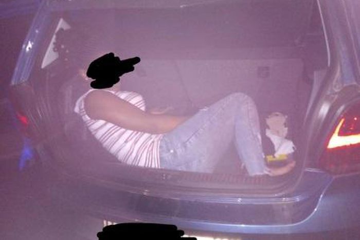 Police arrest man for smuggling woman in his car booth ‘to enhance lockdown experience’